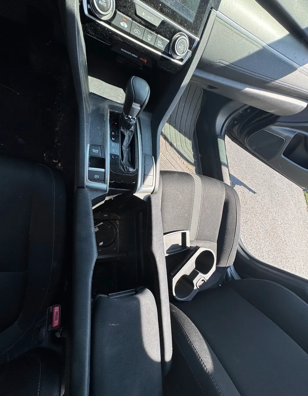 Honda Civic center console and cup holder area during an interior detail